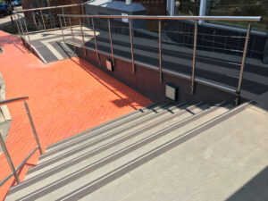 FibreGrip non-slip stair nosing with LumiGlo on tiled staircase at eTV